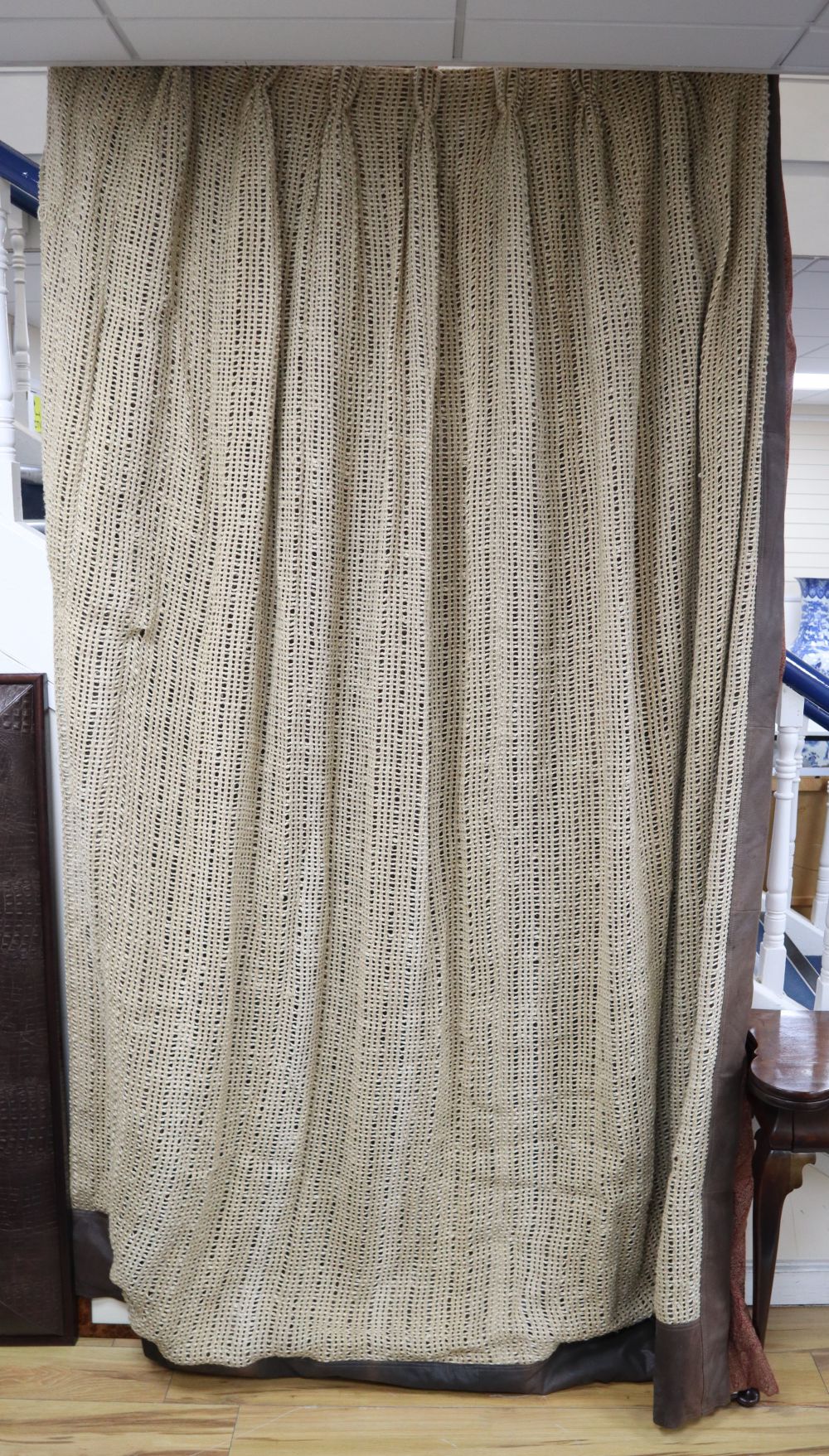 1970's hessian fabric and brown leather curtains, with Paisley fabric trimmed edges.